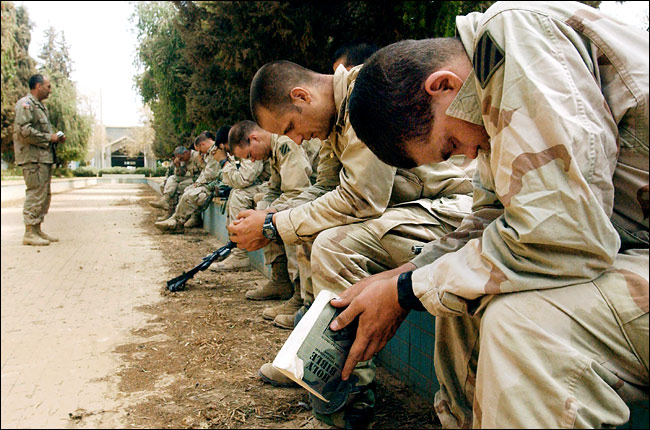 Soldiers from the Army's Third Division Task Force during a religious service, Baghdad International Airport, April 6, 2003.